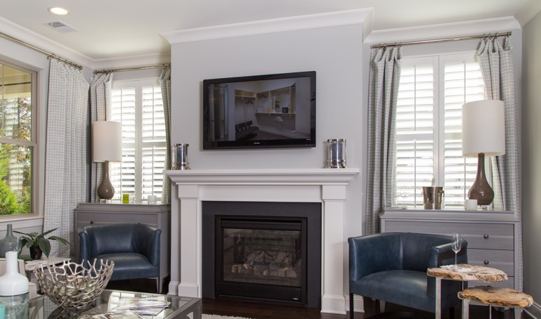 Charlotte fireplace with white shutters.